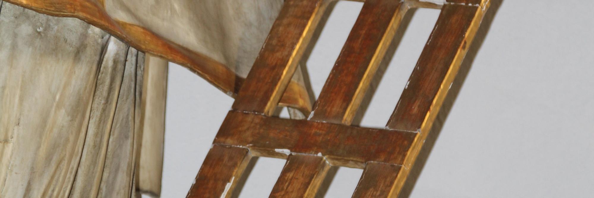 Detail einer Laurentius-Statue: der Rost des heiligen Laurentius